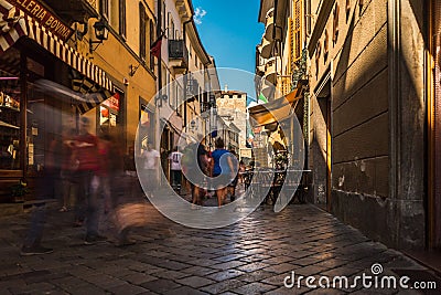 Aosta city center street road people walk fast for shopping Editorial Stock Photo