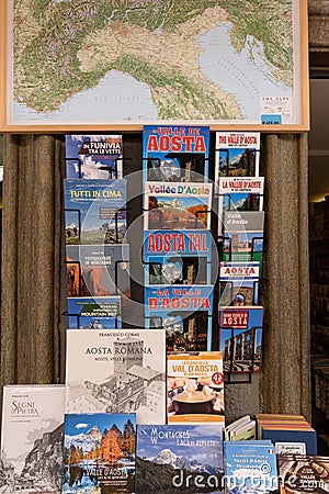 Aosta, Italy. In the historic center of the town, Aosta tourist guide books, geographic maps of Italy and mountain-themed books. Editorial Stock Photo