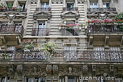 Apartment building with ornate 19th century architecture typical of central Paris Stock Photo