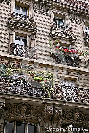 Apartment building with ornate 19th century architecture typical of central Paris Stock Photo
