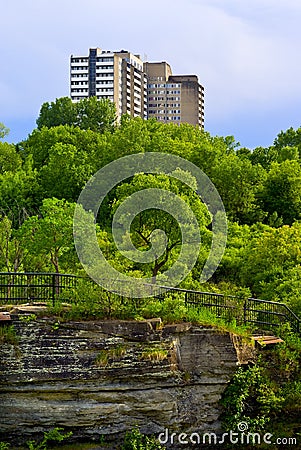 Apartment Building Overlooking Lush Trees Stock Photo