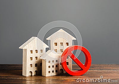 Apartment buildings and red prohibition symbol NO. Emergency and unsuitable for living building. Unavailable expensive housing. Stock Photo