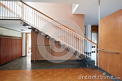 Apartment interior with black marble staircase and wooden floor Stock Photo