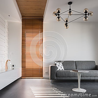 Apartment with wooden blinds and ceiling Stock Photo