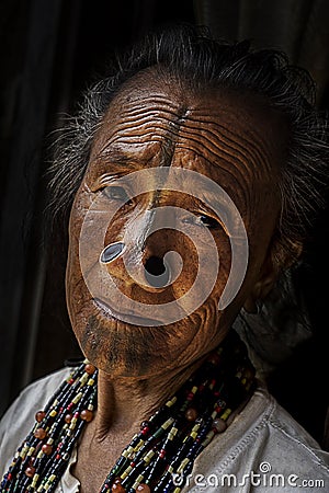 Apatani Tribe - Portrait of an elderly Apatani tribal woman in Ziro, Arunachal Pradesh Editorial Stock Photo