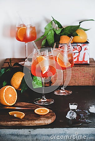 Aperol Spritz aperitif drink in glasses with oranges and ice Stock Photo