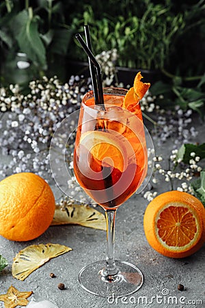 Aperol spritz cocktail on a gray concrete background. a glass of aperol spritz with orange slices. Summer cocktail in a glass Stock Photo