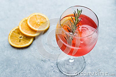 Aperol Spritz Cocktail with Orange Slice, Rosemary and Ice. Stock Photo