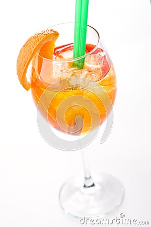 Aperol Spritz in a wine glass with ice cubes decorated with an orange slice on white background, summer cold drink isolated on whi Stock Photo