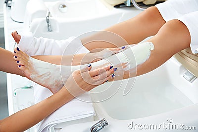 Aplying nourishing moisturizer mask woman legs Stock Photo