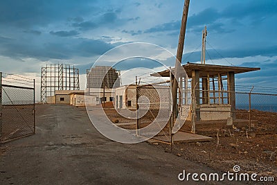 Apocalypse landscape. Military radar and barracks Stock Photo