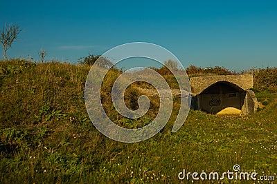 APOLLONIA, ALBANIA: Landscape with the military bunkers in the middle of a rural fields near Apollonia. Stock Photo