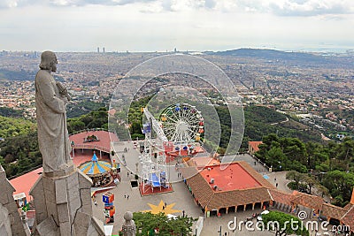 Apostle sculpture is observing Tibidabo Amusement Park and Barcelona City, Barcelona, Catalonia, Spain Stock Photo