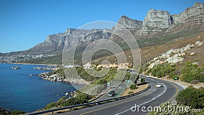 12 Apostles. SOUTH AFRICA - MARCH 18: in this time-lapse view cars drive in front of on March 18, 2010 in Cape Town, South Africa 12 Apostles. SOUTH AFRICA - MARCH 18: in this time-lapse view cars drive in front of on March 18, 2010 in Cape Town, South Africa