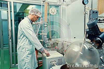 Apothecary extract using cannabis extraction machine in laboratory. Stock Photo