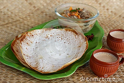 Appam with mutton stew Non-vegetarian sadhya Indian food for Onam sadya Christmas Easter celebration Kerala India Sri Lanka Stock Photo