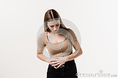 Appendicitis is inflammation of appendix. Girl feel abdominal pain, fever, vomiting, and loss of appetite because of Stock Photo