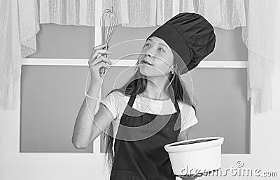 An appetite of pride. kid chef cooking with beater. child prepare healthy food at home and wearing cook uniform Stock Photo