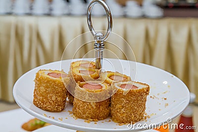 Appetizer, Bread roll with sausage. Stock Photo