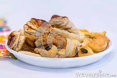 Appetizer and canapés on a white plate on a table at a celebration Stock Photo