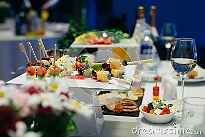 Appetizers on plates. Catering service. Wedding welcome food Stock Photo