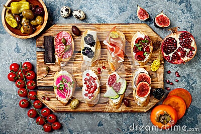 Appetizers table with italian antipasti snacks. Brushetta or authentic traditional spanish tapas set Stock Photo