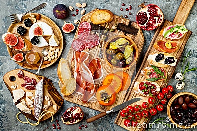 Appetizers table with italian antipasti snacks. Brushetta or authentic traditional spanish tapas set, cheese variety board Stock Photo