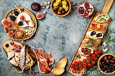 Appetizers table with italian antipasti snacks. Brushetta or authentic traditional spanish tapas set, cheese variety board Stock Photo