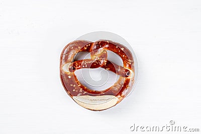 Appetizing Bavarian pretzel isolated on a white background. Top view, copy space, isolated Stock Photo