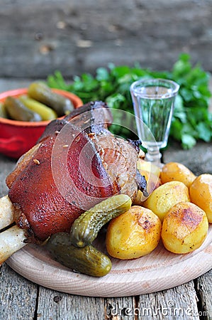 Appetizing Bavarian roast pork knuckle on cutting board Stock Photo