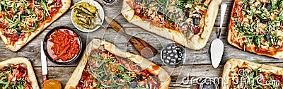 Appetizing homemade pizza on a wooden table. Friendly feast at home. Stock Photo