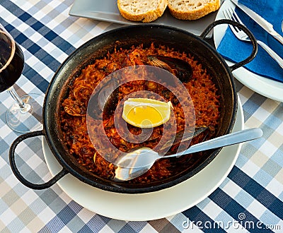 Appetizing seafood dish Paella with shrimp Stock Photo