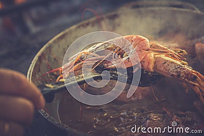 Appetizing shrimp just exacted from the pan. Toned image Stock Photo