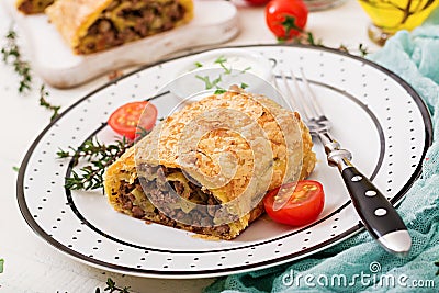 Appetizing strudel with minced beef, onions Stock Photo