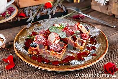 Dessert Belgian waffles with berries and sauce Stock Photo