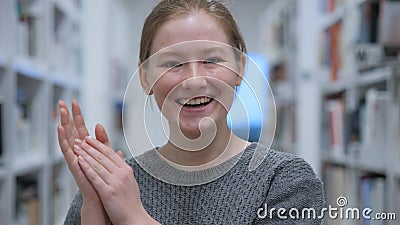 Applauding, Headshot of Happy Young Woman Clapping in Cafe Stock Photo