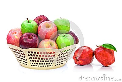 Apples with water drops in basket isolated on white. Stock Photo