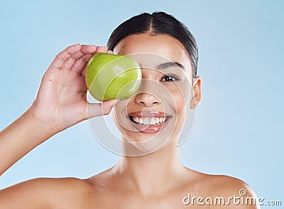 Apple, beauty and woman in a face skincare portrait showing happy, dermatology and facial health results. Young girl Stock Photo