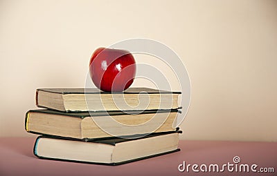 Apple on the book Stock Photo
