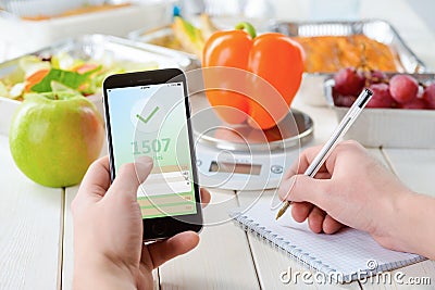 Apple and calorie counter app Stock Photo