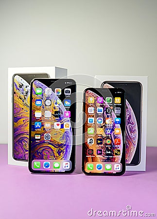 Apple Computers iPhone smartphones next to each other regular and Max version Editorial Stock Photo