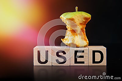 An apple core and the word USED are written on the cubes. Ecology and waste recycling concept Stock Photo