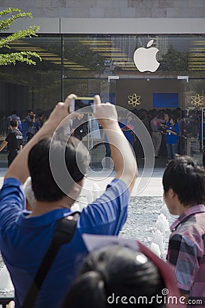 Apple fan using iphone to take picutre Editorial Stock Photo