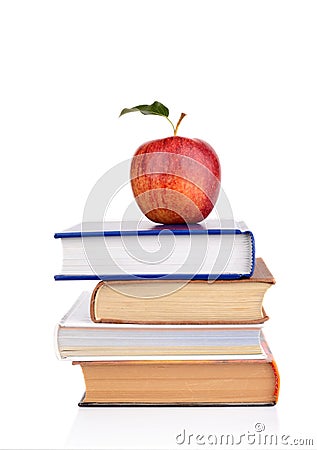 Apple on few school books on a white background Stock Photo