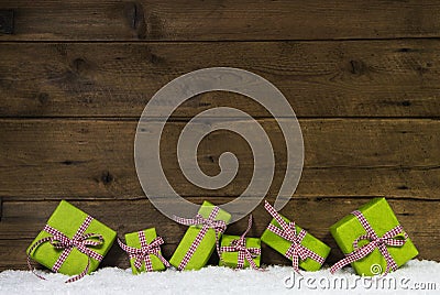 Apple green christmas presents on wooden background for a gift c Stock Photo