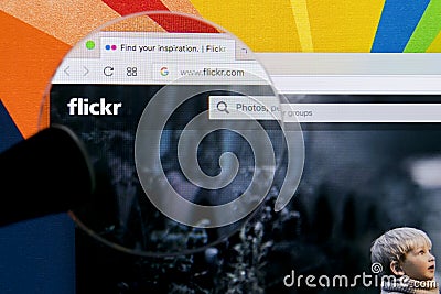 Apple iMac with Flickr homepage on monitor screen. Flickr is the video hosting network website. Homepage of Flickr.com on PC Editorial Stock Photo