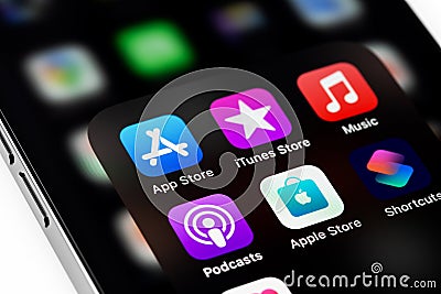 Apple iPhone with AppStore, iTunes, Music, Podcasts Editorial Stock Photo
