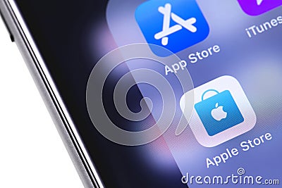 Apple iPhone with icons of AppStore, iTunes, Apple Store. Apple Editorial Stock Photo