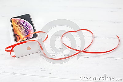 Apple iPhone XS box and Valentine Day red heart Editorial Stock Photo