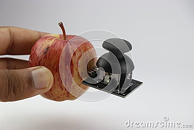 Apple with joystick module attached showing the concept of integrating technology with organic world Stock Photo